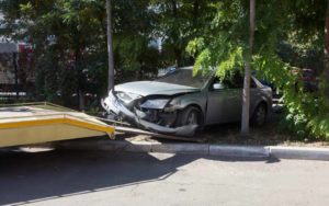Towing Crashed Gray Car