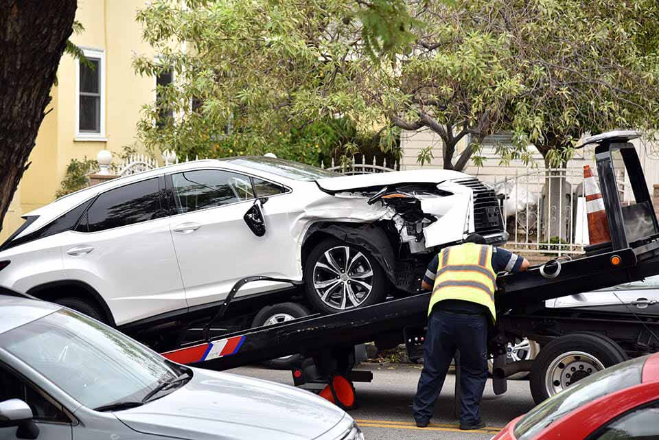 Towing Wrecked White Car
